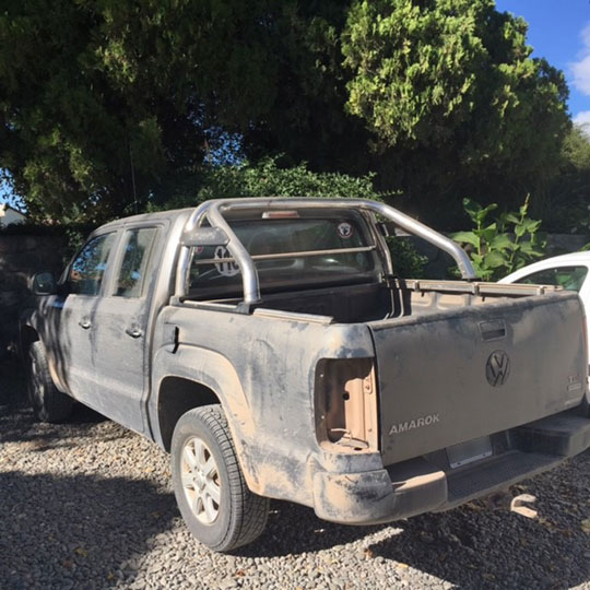 Picture of Bill Bonner's pick-up covered in dust 