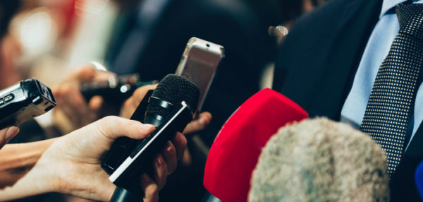 Interviewing business man on press conference