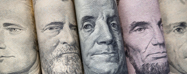 Portraits of U.S. presidents on dollar bills.