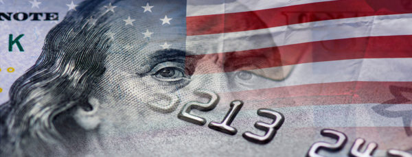 Benjamin Franklin face on top of the american flag